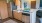 a kitchen with a fridge and a sink
