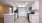 a kitchen with white cabinets