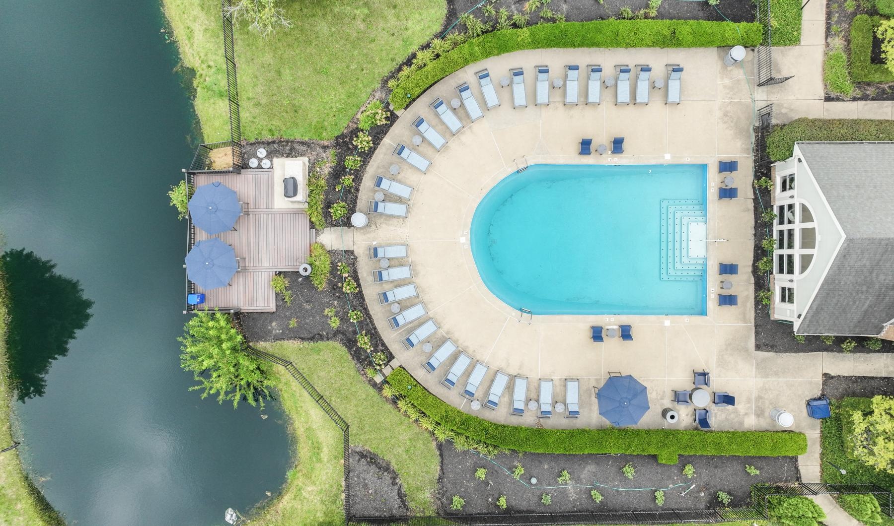 a building with a pool in front of it