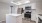 a kitchen with white cabinets