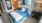 a bed with blue sheets
