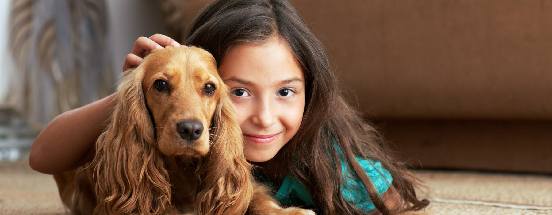 a person lying on the floor with a dog