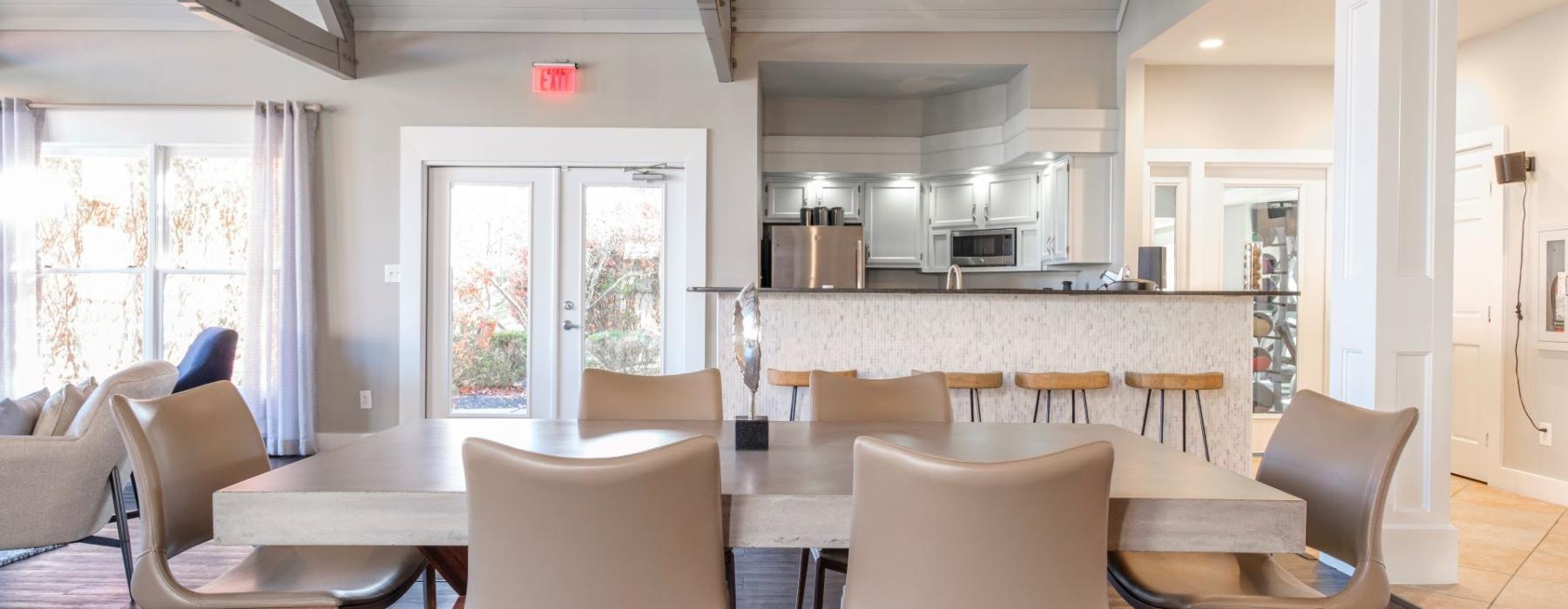 a large kitchen with a dining table